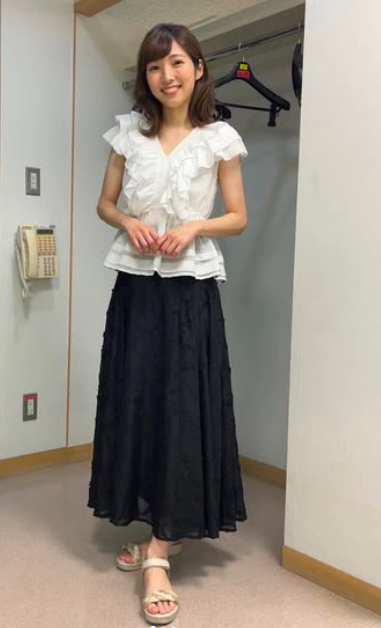 白いトップスを着る森田絹子